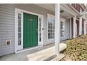 Inviting front porch with a green front door on a sunny day at 20 Pine Canyon Sw Dr # 26, Atlanta, GA 30331