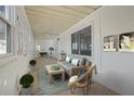 Bright sunroom with comfortable seating, offering a relaxing space with views of the outdoors and fresh air at 138 Elysian Nw Way, Atlanta, GA 30327