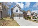 Beautiful two-story home with a two-car garage and a long driveway nestled in a cozy neighborhood at 5780 Crestwick Way, Cumming, GA 30040