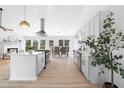 Modern kitchen with stainless appliances, island, and open layout to living spaces at 3407 Deerwood Ct, Rex, GA 30273