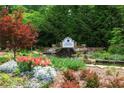 A beautiful community entrance with lush landscaping and a tranquil water feature at 138 Grand Ave, Suwanee, GA 30024