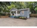 Attractive home with a welcoming porch, colorful landscaping, and concrete driveway at 1812 Defoor Nw Ave, Atlanta, GA 30318