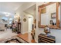 Spacious foyer with hardwood floors and views into the living room, blending classic design at 1152 Simonton Glen Way, Lawrenceville, GA 30045