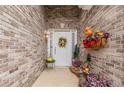 Inviting front porch with seasonal decorations and brick accents, creating a warm welcome at 1152 Simonton Glen Way, Lawrenceville, GA 30045
