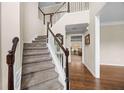 Inviting foyer showcasing hardwood floors and a staircase leading to the second floor at 1803 Gold Finch Way, Lawrenceville, GA 30043