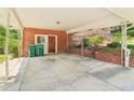 Spacious carport with brick columns, a covered area, and convenient access to the home's side entrance at 454 Jo Ann Se Dr, Marietta, GA 30067