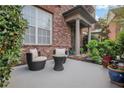 Relaxing outdoor seating area with a small table and potted plants at 552 Micayne Se Cir # 1, Smyrna, GA 30082
