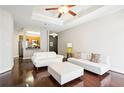 Bright living room features hardwood floors, neutral paint, fan, and an eat-in kitchen view at 325 E Paces Ferry Ne Rd # 810, Atlanta, GA 30305
