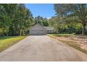 View of the house with a big driveway and front yard at 5623 Yeager Ridge Dr, Douglasville, GA 30135