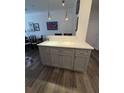 Kitchen island with counter seating and marble countertop in a bright and modern open-concept living space at 400 17Th Nw St # 2031, Atlanta, GA 30363