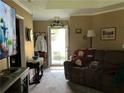 Cozy living room with comfortable seating and a bright view through the doorway, creating an inviting atmosphere at 1109 Granite Ln, Loganville, GA 30052
