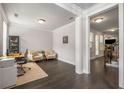 Inviting living room with hardwood floors, neutral walls, and ample natural light, creating a cozy space at 1157 Hannaford Ln, Johns Creek, GA 30097