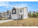 Well-maintained two-story home featuring a garage and a neatly landscaped front yard at 2789 Aralynn Way, College Park, GA 30337