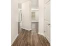 Inviting hallway with beautiful wood-look floors leading to multiple rooms at 2789 Aralynn Way, College Park, GA 30337