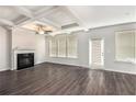Spacious living room with coffered ceiling, fireplace, and large windows at 2789 Aralynn Way, College Park, GA 30337