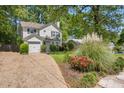 Traditional style home with mature landscaping and attached garage on a sunny day at 1123 Seaboard Nw Ave, Atlanta, GA 30318