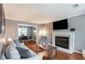 Cozy living room with hardwood floors, fireplace, and stylish furnishings, perfect for relaxing at 1123 Seaboard Nw Ave, Atlanta, GA 30318