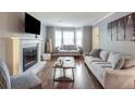 Bright living room with hardwood floors, fireplace, and comfortable seating, creating an inviting atmosphere at 1123 Seaboard Nw Ave, Atlanta, GA 30318