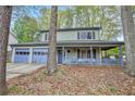 Charming two-story home with a covered porch and a two-car garage at 835 Ridge Ave, Stone Mountain, GA 30083