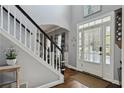 Bright foyer with hardwood floors and staircase, creating an open and inviting entrance to the home at 2241 Harry Brooks Nw Dr, Atlanta, GA 30318
