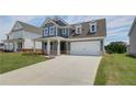 Charming two-story home with a manicured lawn, tasteful landscaping and a two-car garage at 255 Arnewood Cir, Mcdonough, GA 30253