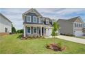 Charming two-story home featuring manicured lawn, tasteful landscaping and a two-car garage at 255 Arnewood Cir, Mcdonough, GA 30253