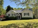 Well-maintained single-story home features a manicured lawn and a welcoming front porch with a classic design at 262 Bomar Ln, Douglasville, GA 30134