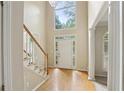 Bright foyer with soaring ceilings, hardwood floors, and elegant staircase that sets a welcoming tone at 100 Julia Ct, Fayetteville, GA 30214