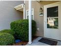 Exterior of home entrance featuring well manicured bushes and clear numbering at 137 Venture Path, Hiram, GA 30141