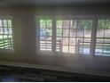 Bright living room featuring large windows offering natural light and dark hardwood flooring at 1956 Shirley Sw St, Atlanta, GA 30311