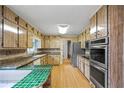 Traditional kitchen with a breakfast bar, stainless steel appliances, and plenty of cabinet space at 3595 Limberlost Sw Trl, Stockbridge, GA 30281