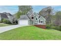 Charming two-story home with an attached two-car garage and a cozy front deck at 4995 Hyde Ct, Cumming, GA 30040