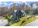 Spacious two-story home with a large lot and well-manicured lawn at 4835 Fields Bridge Rd, Cumming, GA 30028