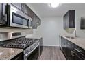 Well-lit kitchen with stainless steel appliances and granite countertops at 6351 Wedgeview Ct, Tucker, GA 30084
