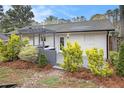 A cozy backyard with a pergola over an outdoor kitchen and ample space for entertaining and relaxing at 2999 San Juan Dr, Decatur, GA 30032