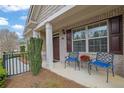 Inviting porch with comfortable seating and a warm, welcoming ambiance at 241 Orchards Cir, Woodstock, GA 30188