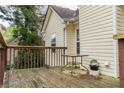 Wooden deck with a table and railing, perfect for outdoor relaxation and entertaining at 703 Paul Revere Dr, Locust Grove, GA 30248