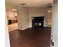 A living room featuring a fireplace and updated hardwood flooring at 3260 Rivermist Cv, Decatur, GA 30034