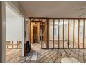 Spacious living room undergoing renovations with exposed beams and hardwood flooring at 1753 Beechwood Sw Blvd, Atlanta, GA 30311