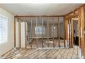 Inviting living room featuring exposed wall beams and a fireplace, ready for renovation at 1753 Beechwood Sw Blvd, Atlanta, GA 30311