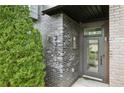 Charming front entrance with a modern brick facade and a well-manicured evergreen shrub at 728 Oakview Rd, Decatur, GA 30030