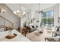 Open floor plan features high ceilings, modern lighting, a staircase with metal railings, and luxury decor at 728 Oakview Rd, Decatur, GA 30030