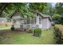 Traditional home with a inviting front porch and well-maintained landscaping at 972 Sims Nw Ave, Atlanta, GA 30318