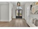 Grand foyer with light hardwood floors, decor, an arched doorway and plenty of natural light at 103 Candler Loop, Acworth, GA 30101