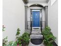 Inviting entryway with a stylish blue front door and decorative landscaping at 1363 Brentwood Ln, Marietta, GA 30062