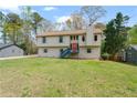 Inviting front exterior with well-manicured lawn and tidy landscaping at 1612 Sky Crest Dr, Lithia Springs, GA 30122