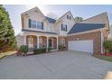 Desirable two-story home with brick and siding, attached two car garage, and lovely front yard at 917 Redstone Trl, Dacula, GA 30019