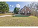 Beautiful home on a sprawling lawn featuring mature trees and a long drive at 917 Redstone Trl, Dacula, GA 30019