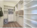 Walk-in closet with custom shelving, providing ample storage space at 4210 Provenance Trl, Cumming, GA 30028
