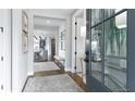 Bright and inviting foyer with hardwood floors and elegant decor at 4210 Provenance Trl, Cumming, GA 30028